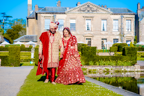 Couple look back on stunning Asian wedding with ambitious UK-first after travelling thousands of miles to find the perfect venue