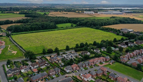 Development firm sells land for 210 new homes and primary school in Warwickshire